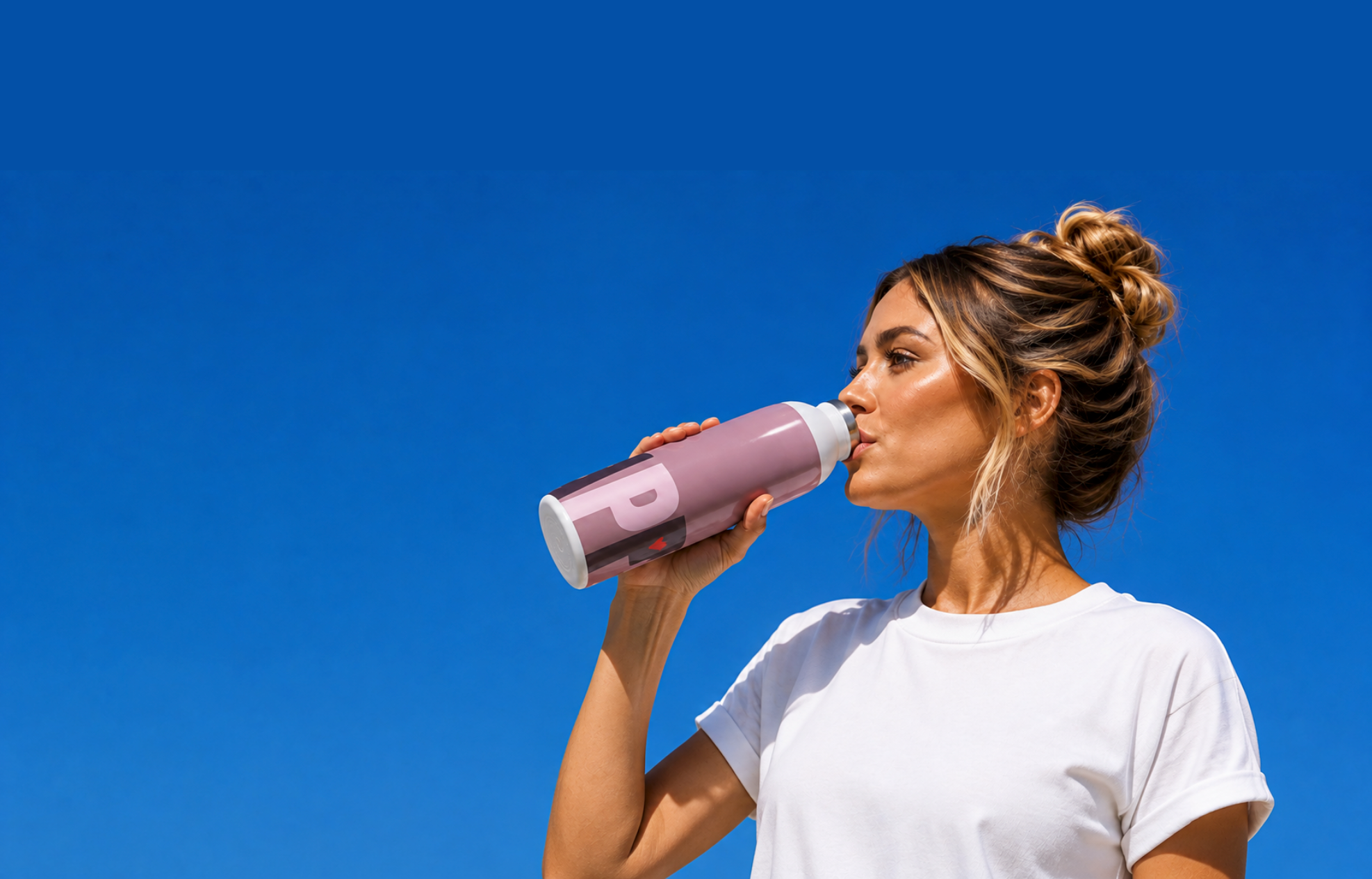 woman drinking the happy bottle in cherry blossom